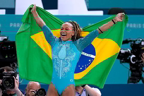 Rebeca Andrade, of Brazil, celebrates after winning the gold medal